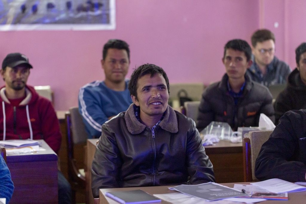 Junior paraveterinary technician training workshop in a pink-walled classroom in Manang, Nepal.