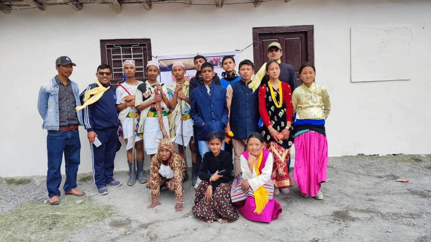 Photo of students performing a street drama to raise awareness about human-wildlife conflict mitigation, promote coexistence with snow leopards, and celebrate them as a culturally important species in the Lower Mustang region of Nepal.