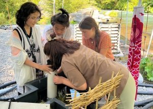 LOSL Youth view salmon eggs before their ceremonial release - Run4Salmon