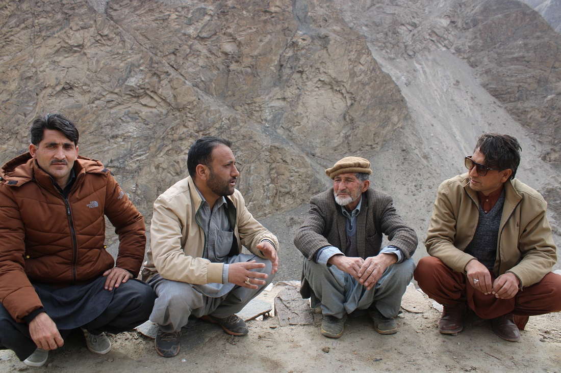 Raza Muhammad of the BWCDO meets with herder Arman Shah of Gilgit Baltistan, Pakistan, to discuss protection of livestock from predators and snow leopards.
