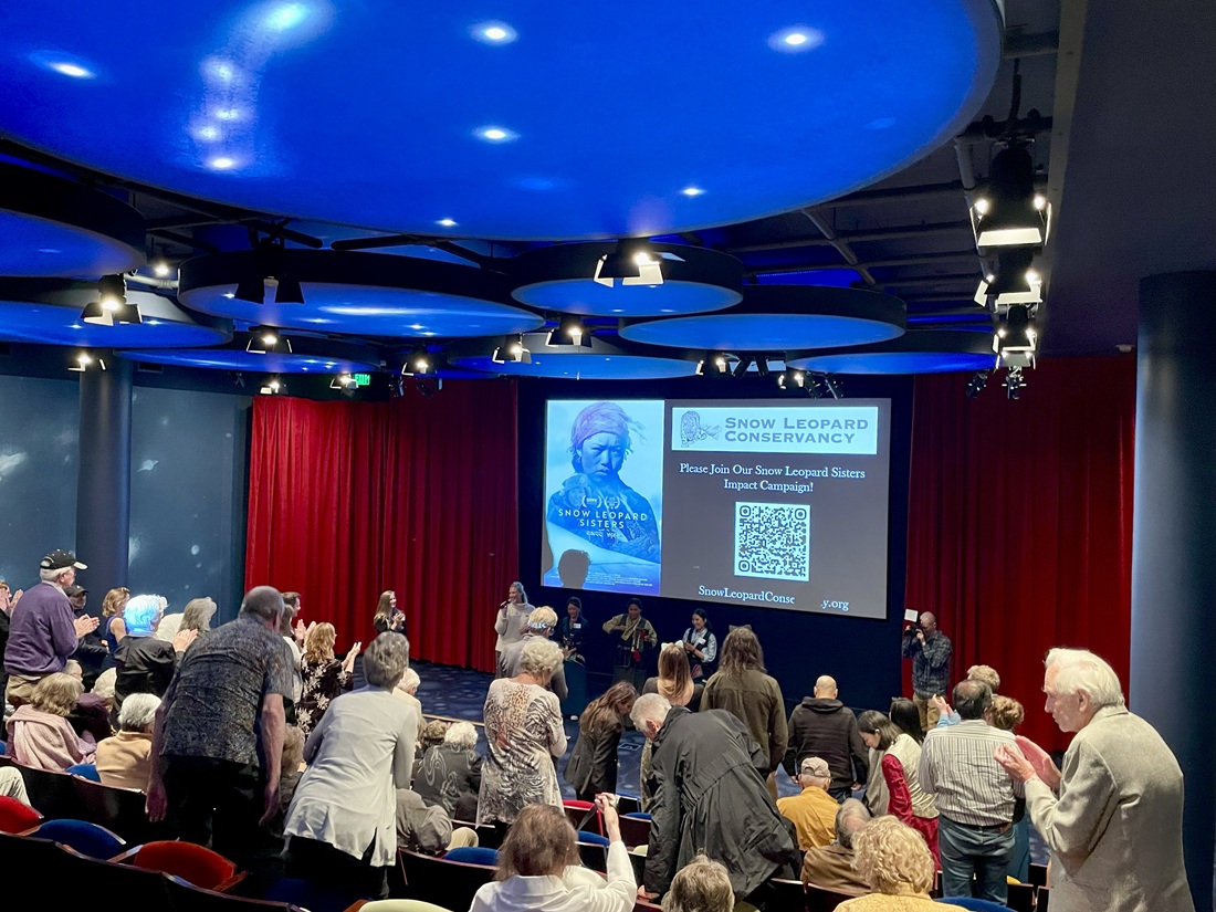 Snow Leopard Conservancy supporters give a standing ovation for the film Snow Leopard Sisters at the 25th Anniversary celebration held at the Disney Museum