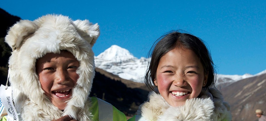 Kids celebrate culture and biodiversity at the Jomolhari Mountain Festival in Bhutan. SLC is partnering with the Bhutan Foundation - Promoting PEaCE.