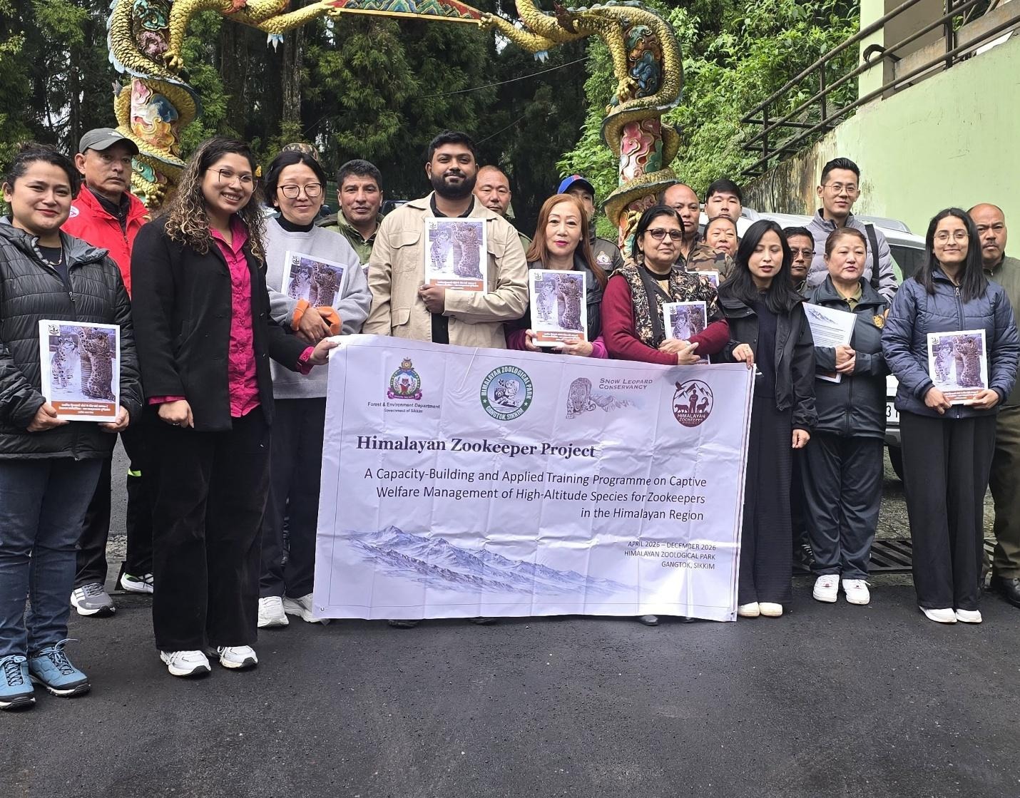 A group photo of the Himalayan Zoological Park zookeepers, conservationists, veterinary staff, and Zoologist Karik Thevar, pictured at the zoological park.